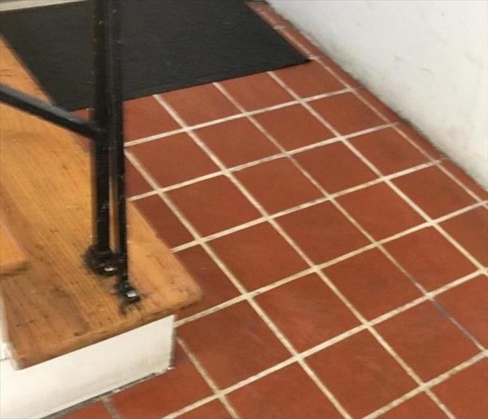 clean red tile with white grout lines 