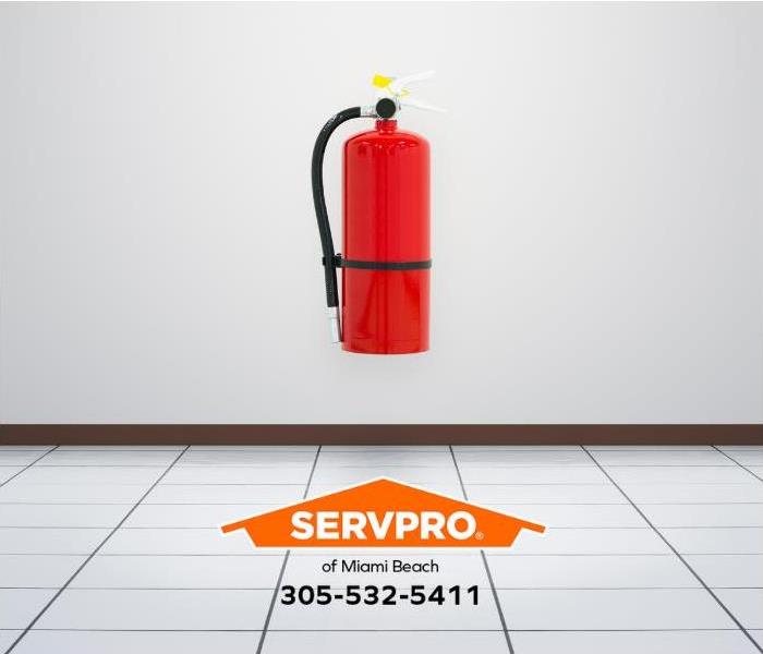 A fire extinguisher is mounted on a wall.