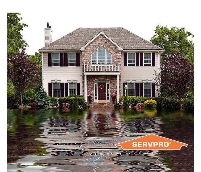 house with standing water in front 