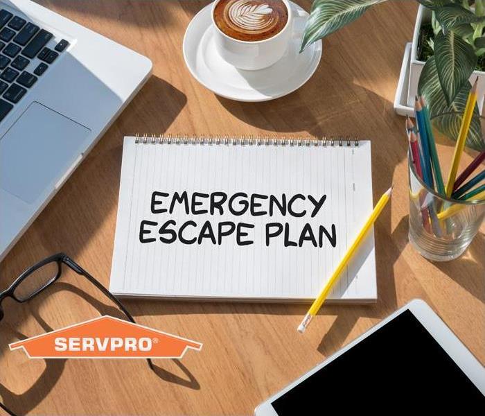 note pad with emergency escape written on it  plan 